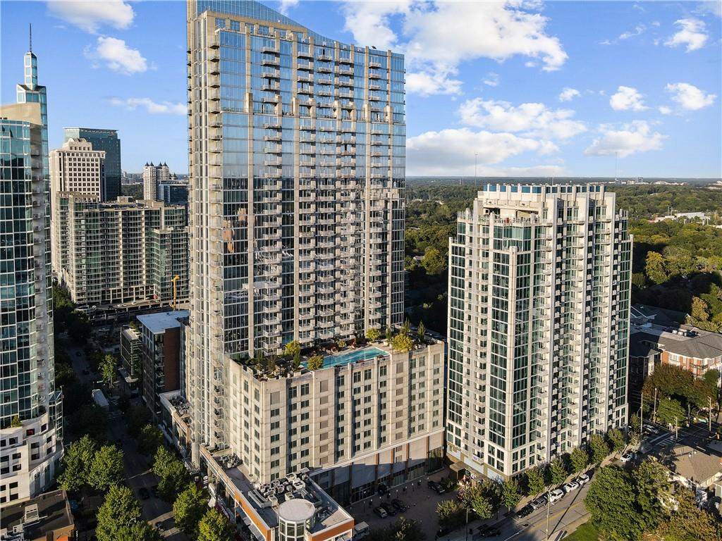 Luxury Glass High Rise Apartments with Rooftop Pool and City Skyline View.jpg