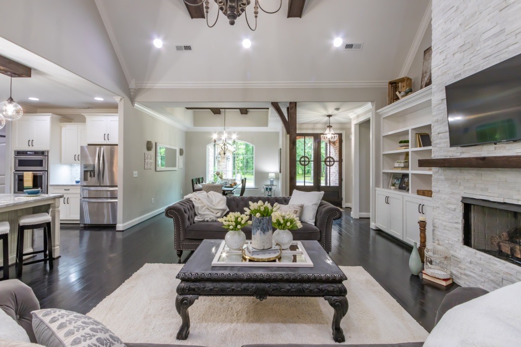 Modern Farmhouse Open Concept Living with White Stone Fireplace and Vaulted Ceilings.jpg